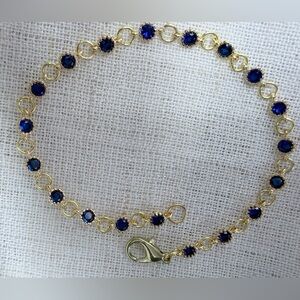 18K gold plated bracelet w sparkling round blue CZ stones. 7.5” .Perfect GIFT !